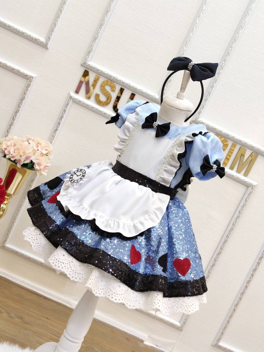 Alice birthday dress. Detail of the white frilly apron and card suit appliqués on the front of the
