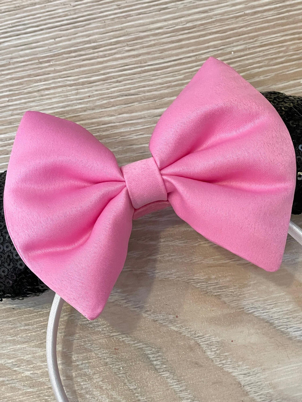 Pink Minnie Mouse dress hair accessory close up