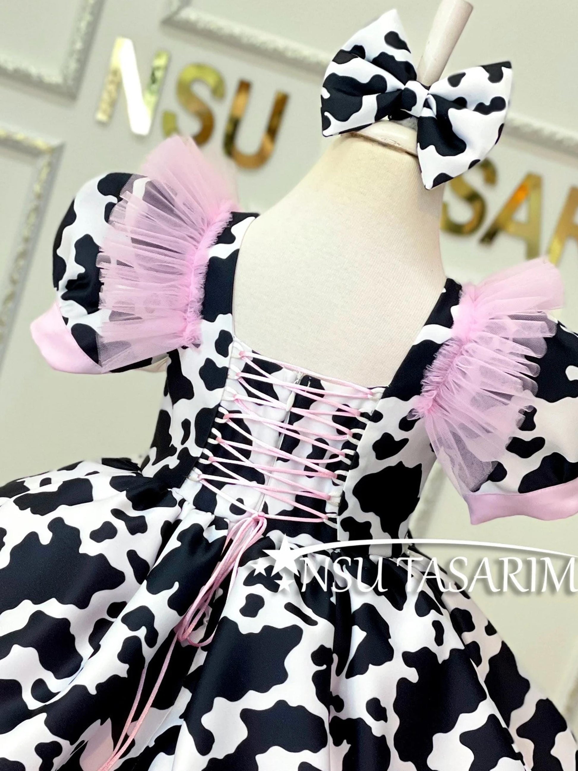 Cow theme costume back side top side close up