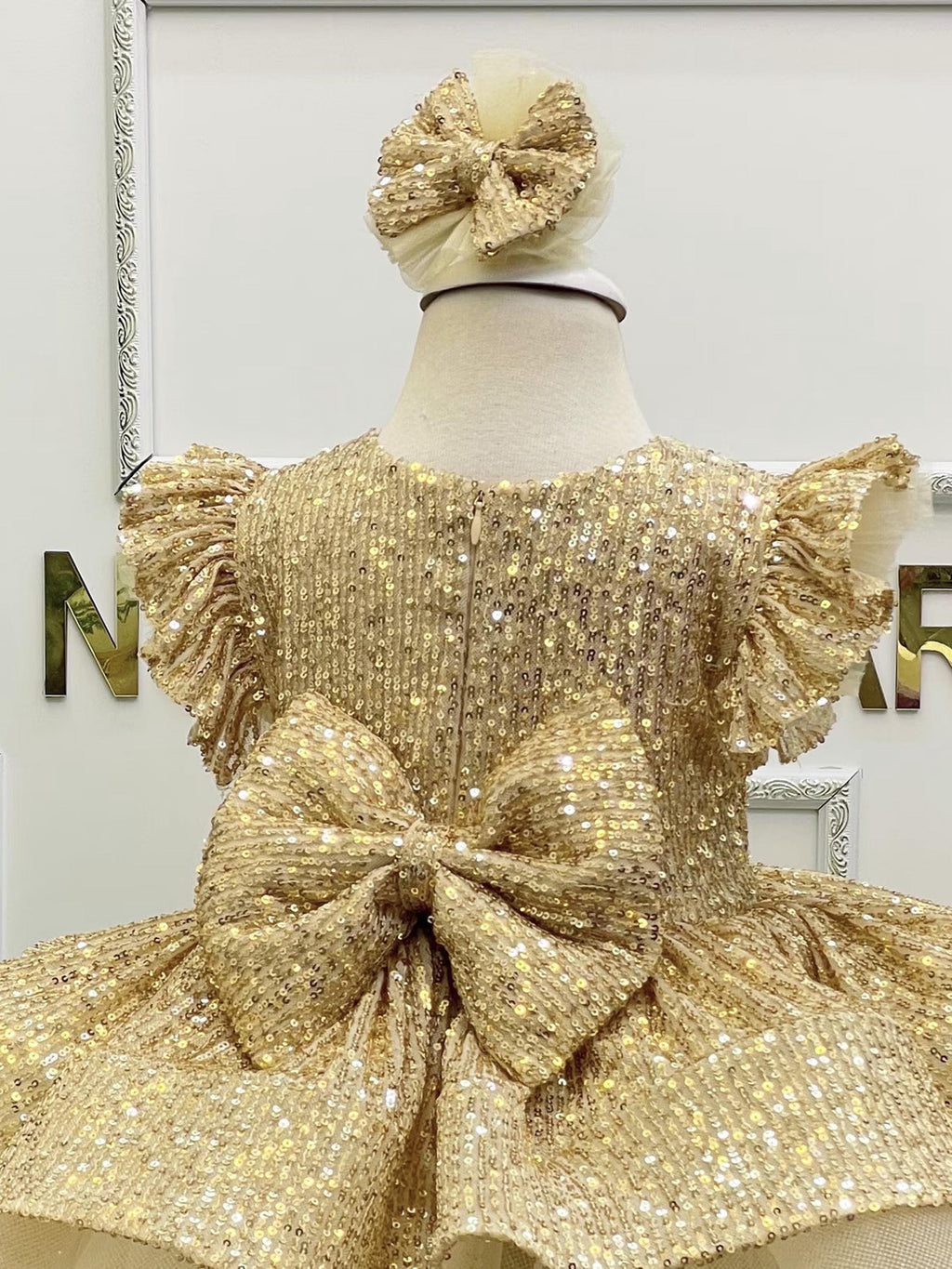 Our Gold Sequin Holiday Dress back bow and zipper