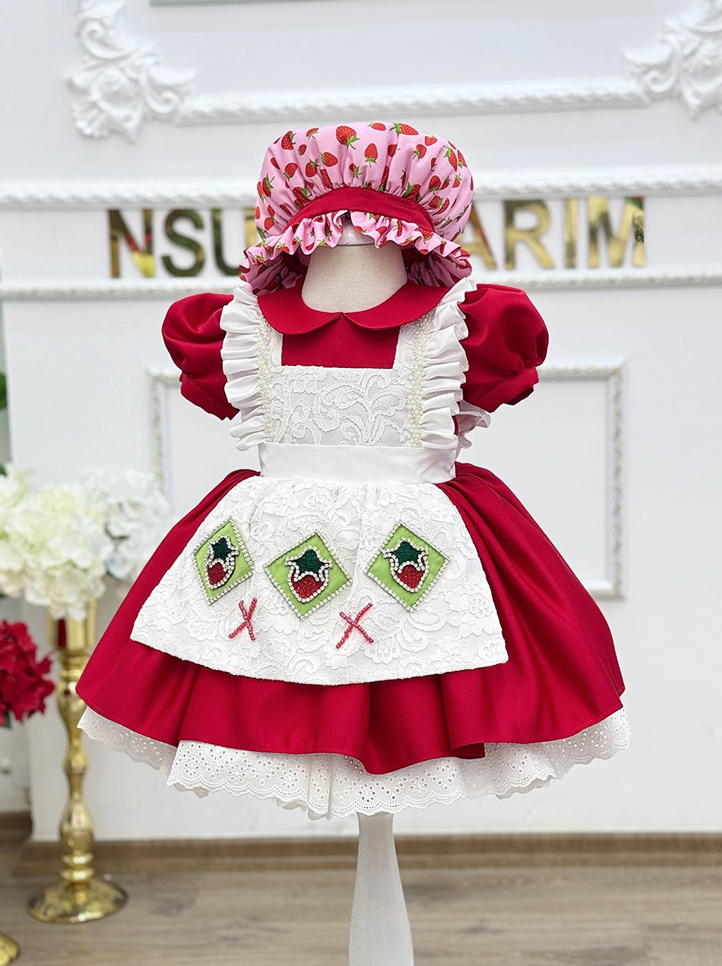 Red puff sleeve dress with strawberry bonnet